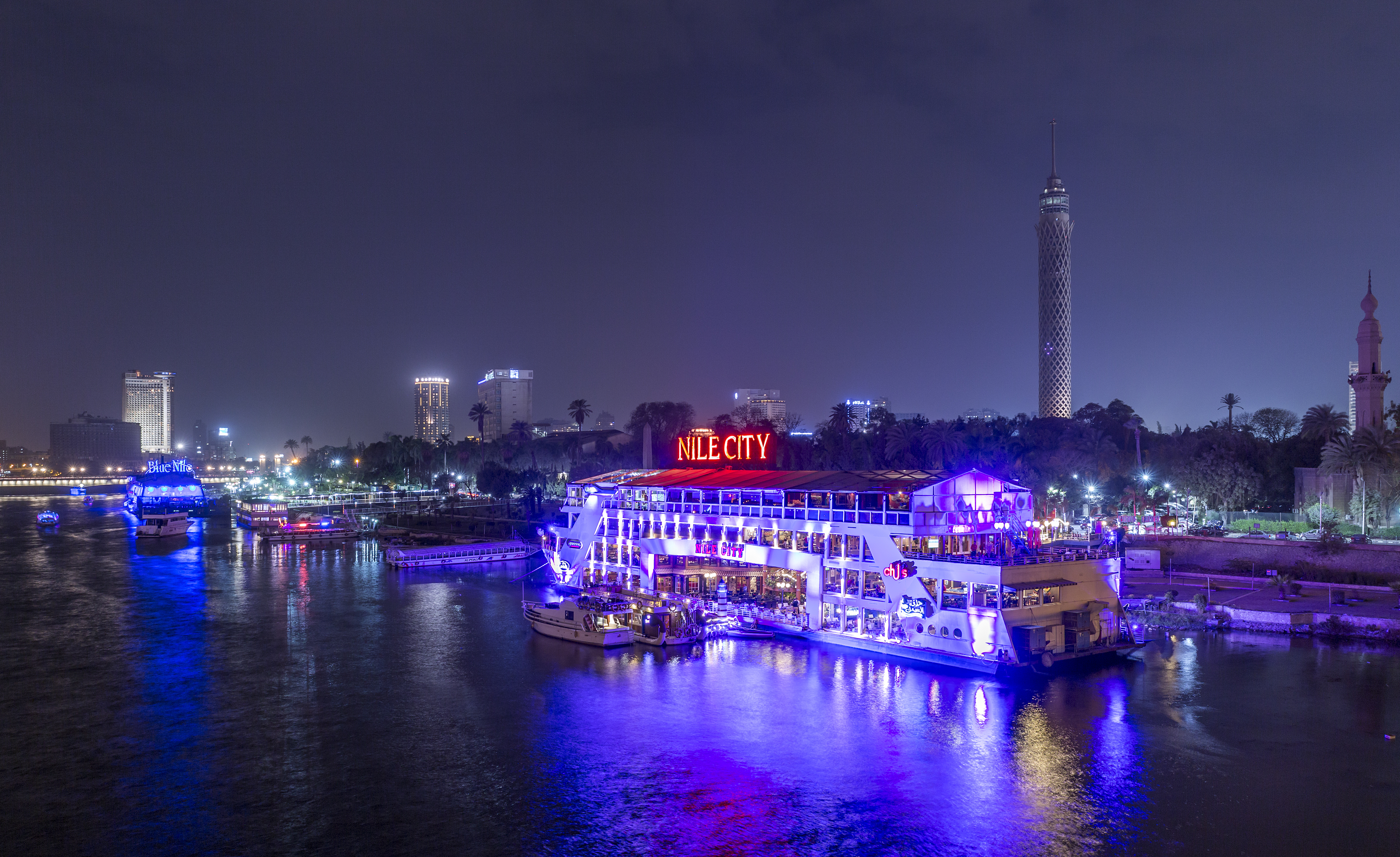 The Island of Zamalek in central Cairo at night, with it's famous boat restaurants on the Nile river.